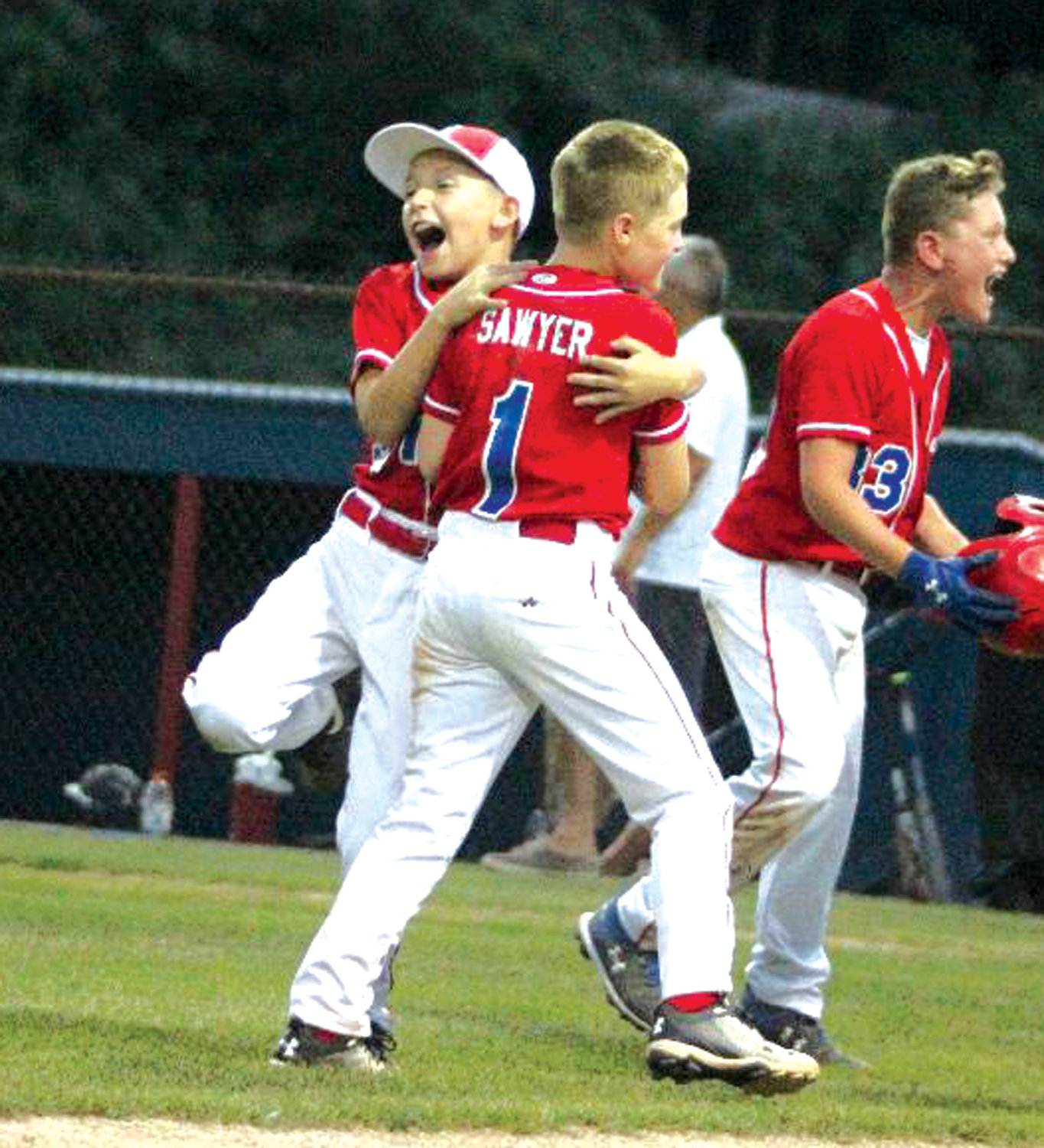 CELEBRATE GOOD TIMES: Members of the WCA 10’s celebrate after winning the District 3 title.