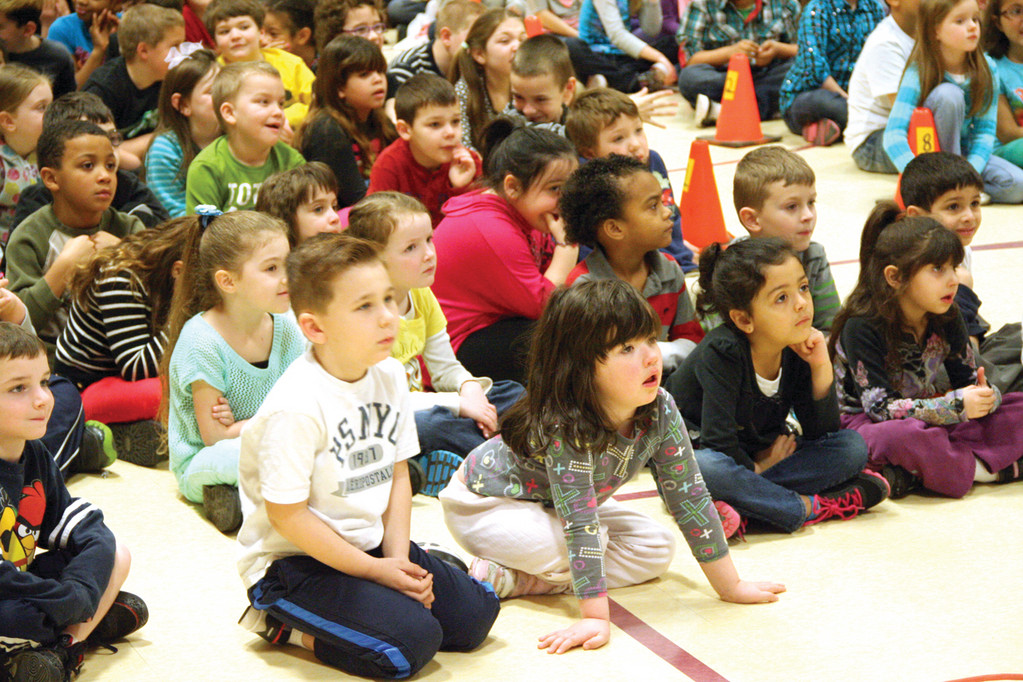 SOAKING IN THE MESSAGE: John Wickes School students listen to the book “Is Your Hair Made of Donuts?”