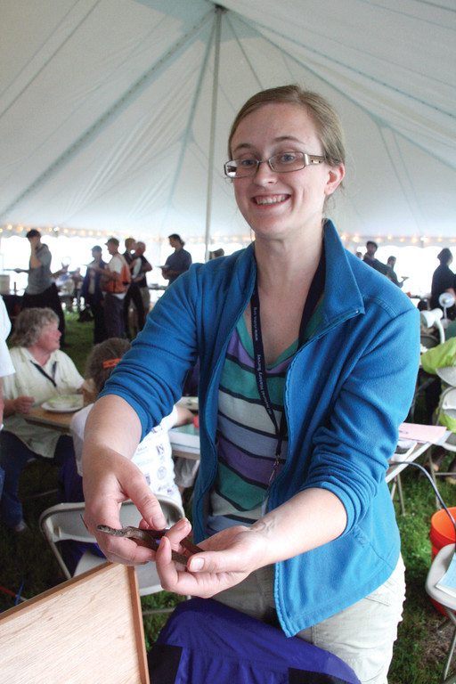 DELIGHTED BY A SNAKE: Molly Allard with a brown snake, one of several species of snake found during the BioBlitz.