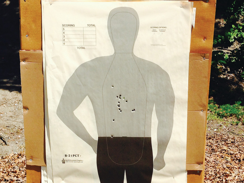 RIGHT ON TARGET: Shots fired from the pistol qualifications hit inside the bodied area of the target. An officer must make at least 25 of 37 shots in order to qualify.