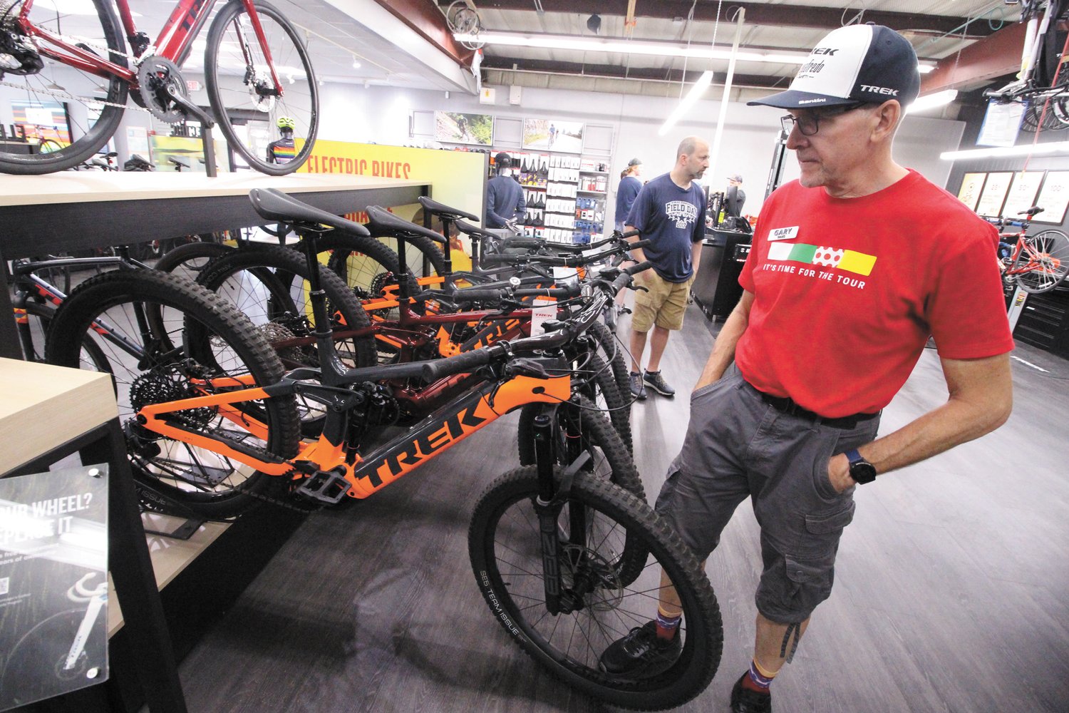 PEDAL POWER: Gary Stafford, a sales representative at Trek Bicycle Warwick shows of a mountain E-bike which can cost about $8,000. (Beacon Communications photos)