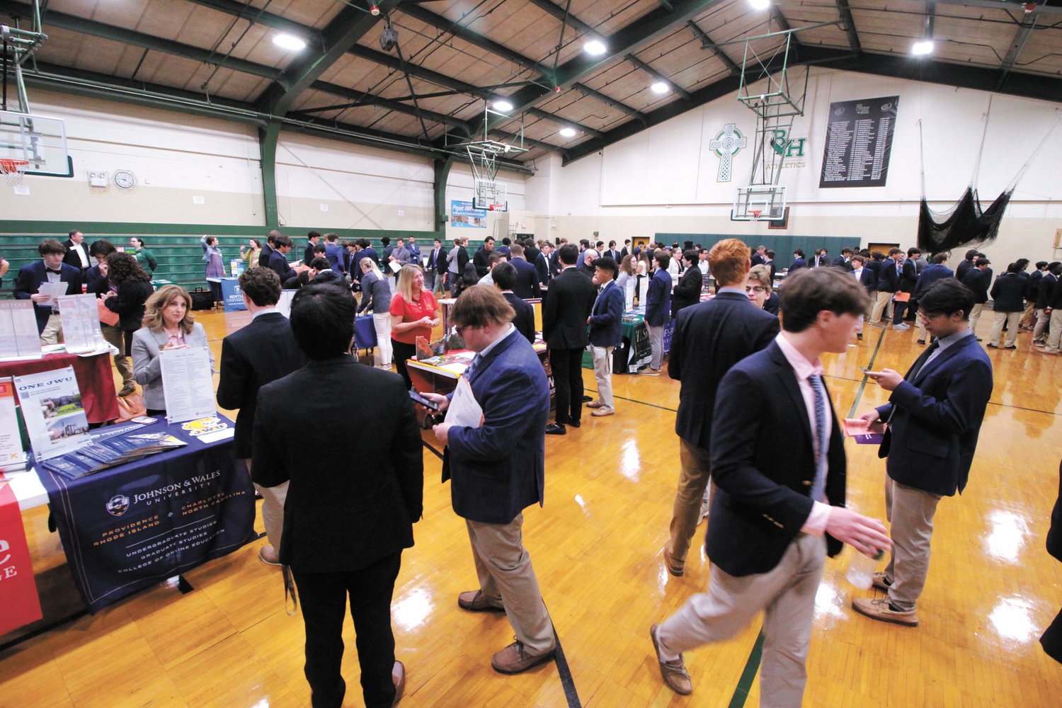 PACKED IN: More than 130 institutions were represented at the Hendricken college fair that was held in the school’s two gymnasiums last Friday.