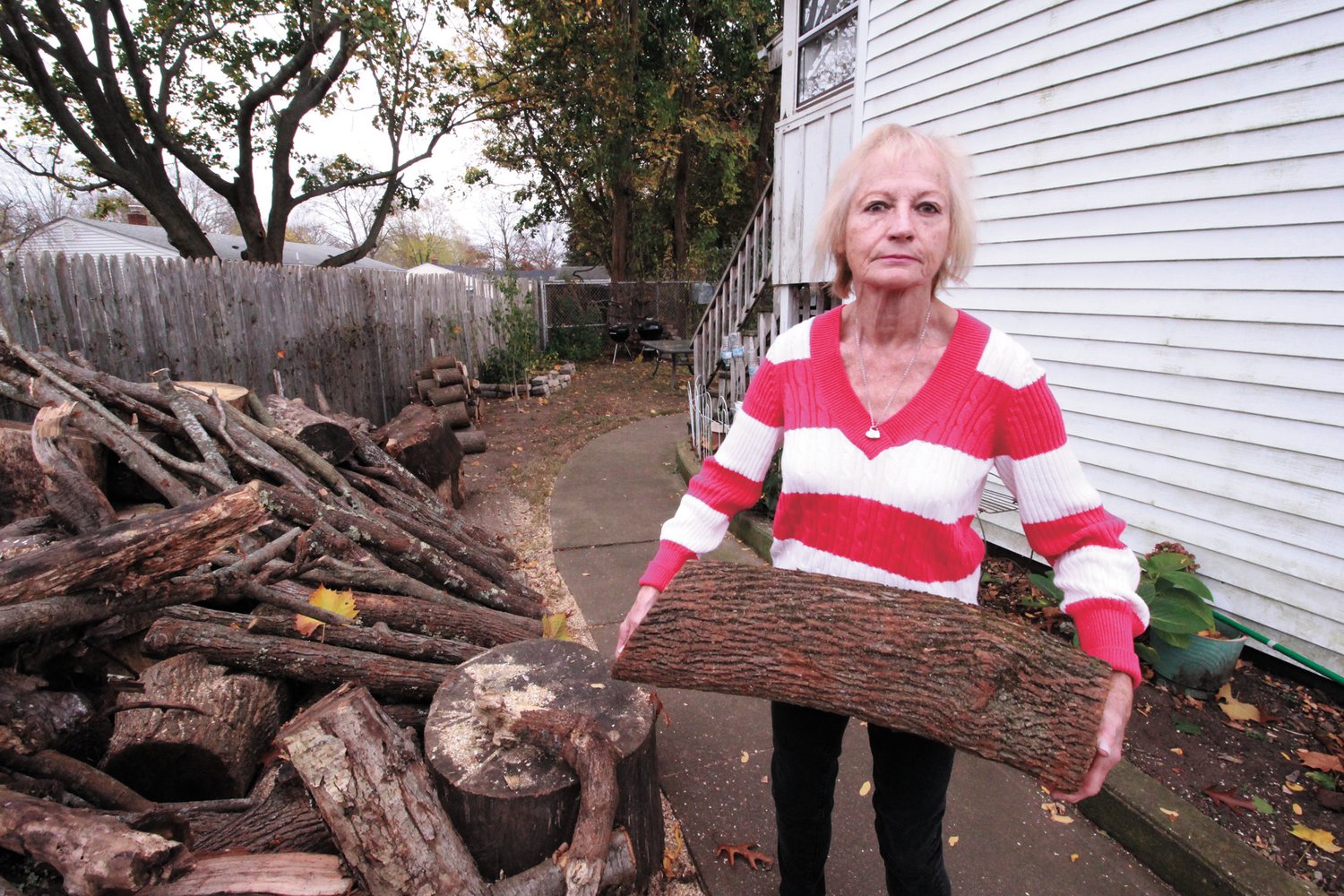 SHE CAN HANDLE IT:  As long as she has access to wood, Beatrice “Cookie” Pelletier will find a way of using it to heat her home, (Warwick Beacon photo)