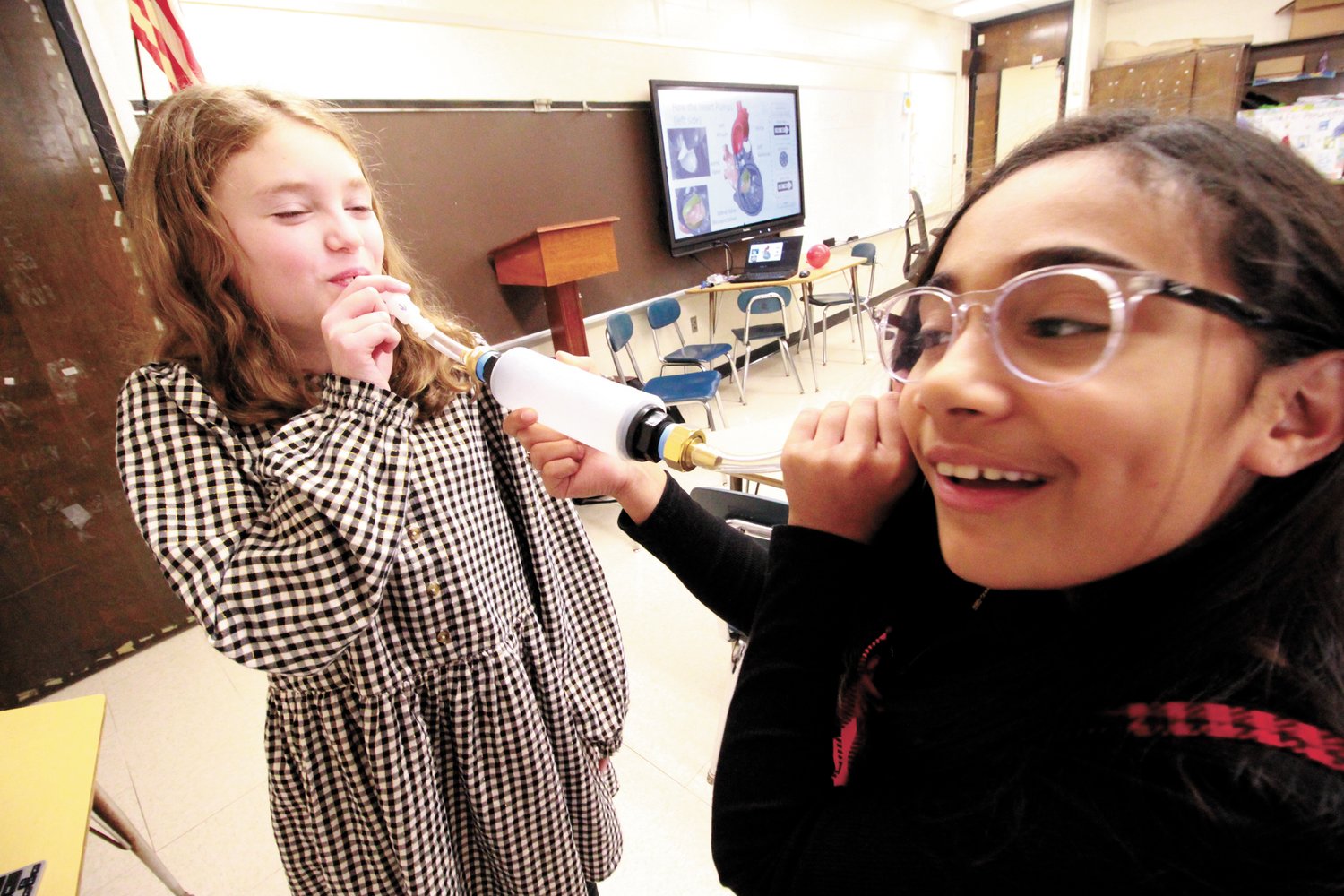 CAN YOU HEAR ME? As they waited their see how a valve and chamber system pump works, Kasidhe Birch and Aryana Cuello explore whether it might also work for communication.