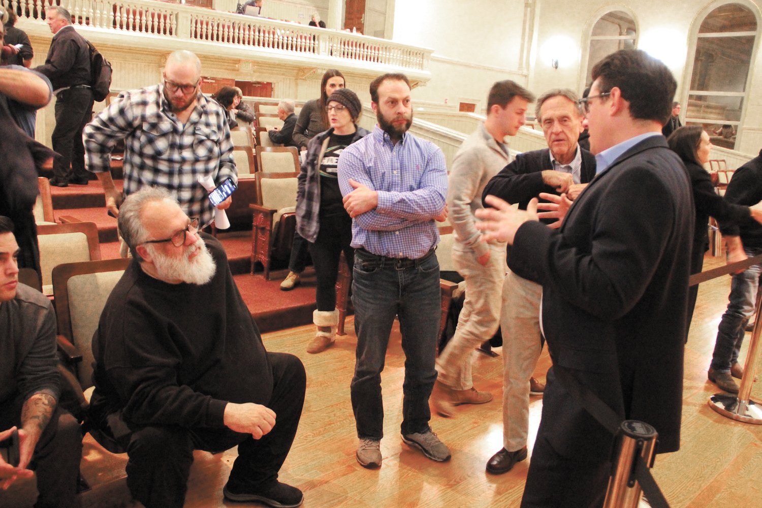 WHAT’S IT MEAN? Ward 9 Councilman Vincent Gebhart addresses the questions of Gerald Galleshaw as landlords congregate at the end of Monday’s hearing of an ordinance that would control Airbnbs. (Warwick Beacon photos)