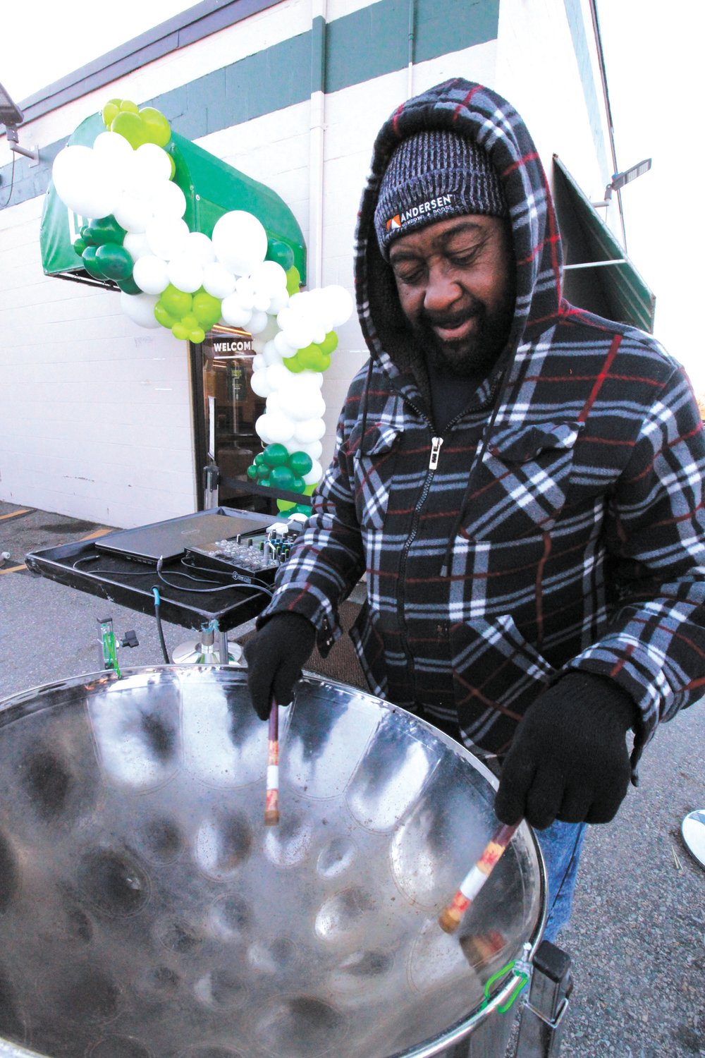 DRUMMING UP BUSINESS: Bernell Henry of the Caribbean Vibe Steel Band entertained customers on the opening day of recreational marijuana sales at the RISE shop, formerly the Summit Compassion Center, on Jefferson Boulevard in Warwick.